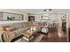 Comfortable living room featuring a large sectional sofa and views into the kitchen at 3390 Ocean Shore Blvd # 4020, Ormond Beach, FL 32176