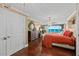 Bright main bedroom with hard wood floors, an elegant chandelier, and beautiful ocean views at 3390 Ocean Shore Blvd # 4020, Ormond Beach, FL 32176