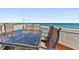 Relaxing rooftop deck featuring outdoor dining with ocean views at 3390 Ocean Shore Blvd # 4020, Ormond Beach, FL 32176