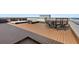 Expansive rooftop deck with comfortable seating, dining area, and outdoor living space at 3390 Ocean Shore Blvd # 4020, Ormond Beach, FL 32176