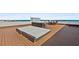 Luxurious rooftop deck with a daybed, seating, and stunning ocean views at 3390 Ocean Shore Blvd # 4020, Ormond Beach, FL 32176
