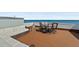 Expansive rooftop deck featuring ocean views and comfortable lounge and dining seating area at 3390 Ocean Shore Blvd # 4020, Ormond Beach, FL 32176