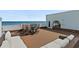 An expansive rooftop deck offers ocean views and a relaxing seating area at 3390 Ocean Shore Blvd # 4020, Ormond Beach, FL 32176