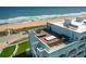 This home features a rooftop deck with ocean views and outdoor furniture at 3390 Ocean Shore Blvd # 4020, Ormond Beach, FL 32176