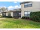 Beautiful backyard with a screened lanai and lush landscaping at 1320 Hansberry Ln, Ormond Beach, FL 32174