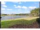 Breathtaking backyard view of the tranquil lake and surrounding landscape at 1320 Hansberry Ln, Ormond Beach, FL 32174