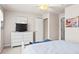 Bright bedroom featuring a queen bed, dresser, and white color palette at 1320 Hansberry Ln, Ormond Beach, FL 32174