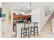 Contemporary kitchen featuring a breakfast bar and staircase access at 1320 Hansberry Ln, Ormond Beach, FL 32174