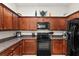 View of the kitchen, showing the cabinets, microwave, oven and countertop at 1320 Hansberry Ln, Ormond Beach, FL 32174