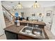 View of the kitchen sink overlooking the dining room and living room at 1320 Hansberry Ln, Ormond Beach, FL 32174