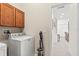 Well-equipped laundry area with cabinets and modern appliances at 1320 Hansberry Ln, Ormond Beach, FL 32174