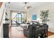 Comfortable living room with hardwood floors and sliding glass doors to outdoor view at 1320 Hansberry Ln, Ormond Beach, FL 32174