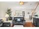 Cozy living room with hardwood floors, seamlessly connected to the dining area at 1320 Hansberry Ln, Ormond Beach, FL 32174