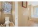 Bathroom offers a toilet and soaking tub for relaxation at 187 Indian Wells Ave, Kissimmee, FL 34759