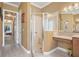 Bathroom boasts a glass-enclosed shower, vanity area, and natural light at 187 Indian Wells Ave, Kissimmee, FL 34759