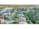 Aerial view of the neighborhood with tree-lined streets and well-maintained homes at 187 Indian Wells Ave, Kissimmee, FL 34759