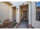 Inviting front entrance with brick pavers, neutral stucco, and modern lighting fixtures at 187 Indian Wells Ave, Kissimmee, FL 34759