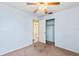 Cozy bedroom with ceiling fan and closet, ready for your personal touch at 24 River Dr, Ormond Beach, FL 32176