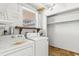 Utility room with washer and dryer hookups and storage shelves at 24 River Dr, Ormond Beach, FL 32176