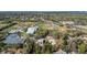 Overhead shot of local sports complex with tennis courts, ball fields and gymnasium in wooded, residential area at 1 Tomoka Oaks Blvd # 112, Ormond Beach, FL 32174