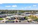 Overhead view of a commercial center with a breakfast cafe, shops, clock tower and ample parking at 1 Tomoka Oaks Blvd # 112, Ormond Beach, FL 32174