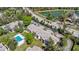 Overhead shot of complex featuring a community pool, lush landscaping, and convenient access to the main road at 1 Tomoka Oaks Blvd # 112, Ormond Beach, FL 32174