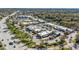 Aerial view of a shopping center with multiple stores, parking lots, landscaping and access roads at 1 Tomoka Oaks Blvd # 112, Ormond Beach, FL 32174