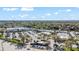 Overhead view of a shopping center with ample parking, retail stores, palm trees and nearby highway at 1 Tomoka Oaks Blvd # 112, Ormond Beach, FL 32174