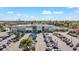 Aerial view of a Publix grocery store featuring an expansive parking lot, palm trees and other retail stores at 1 Tomoka Oaks Blvd # 112, Ormond Beach, FL 32174