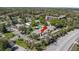 Aerial view of property showcasing its landscaped grounds, community pool, and proximity to nearby amenities at 1 Tomoka Oaks Blvd # 112, Ormond Beach, FL 32174