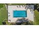 Overhead view of the fenced community pool offering a relaxing area for residents to unwind and enjoy the outdoors at 1 Tomoka Oaks Blvd # 112, Ormond Beach, FL 32174