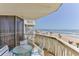 Oceanfront balcony with seating offers stunning views of the beach and ocean at 1133 Ocean Shore Blvd # 302, Ormond Beach, FL 32176