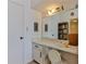 Bathroom vanity area featuring a large mirror and vanity lighting at 1133 Ocean Shore Blvd # 302, Ormond Beach, FL 32176