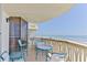 Balcony with seating area overlooking a beautiful ocean view at 1133 Ocean Shore Blvd # 303, Ormond Beach, FL 32176