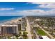 Expansive aerial view showcasing the beautiful coastline, city, and intercoastal waterways at 1425 Ocean Shore Blvd # 102, Ormond Beach, FL 32176