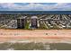 Panoramic aerial view showcasing oceanfront condos, nearby beach access, and intercoastal waterway at 1425 Ocean Shore Blvd # 102, Ormond Beach, FL 32176