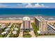 Stunning aerial view of beachfront condos, sugar sand beaches, and the beautiful Atlantic Ocean at 1425 Ocean Shore Blvd # 102, Ormond Beach, FL 32176