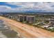 Breathtaking aerial view featuring condos with beach access nestled between ocean and intercoastal waterway at 1425 Ocean Shore Blvd # 102, Ormond Beach, FL 32176