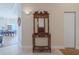 Foyer area with a decorative wood hall tree featuring a mirror, hooks, and storage shelves at 1425 Ocean Shore Blvd # 102, Ormond Beach, FL 32176