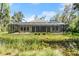 Screened-in back porch overlooking the serene pond at 2337 Legacy Ln, New Smyrna Beach, FL 32168