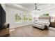 Spacious main bedroom with natural light from large windows and comfortable seating area, perfect for relaxation at 2337 Legacy Ln, New Smyrna Beach, FL 32168