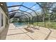 Relaxing screened-in pool with plenty of space for outdoor seating at 2337 Legacy Ln, New Smyrna Beach, FL 32168