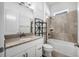 Bathroom featuring a bathtub and shower combination with tile walls and a vanity with granite countertop at 525 Mosaic Blvd, Daytona Beach, FL 32124