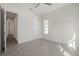 Bright bedroom featuring a ceiling fan, a window that provides natural light, and tile flooring at 525 Mosaic Blvd, Daytona Beach, FL 32124