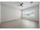 Well-lit bedroom featuring tile flooring and a large window at 525 Mosaic Blvd, Daytona Beach, FL 32124