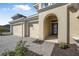 Inviting entryway featuring a decorative glass door and convenient three-car garage at 525 Mosaic Blvd, Daytona Beach, FL 32124