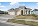 Attractive home with a three-car garage and beautifully landscaped front yard at 525 Mosaic Blvd, Daytona Beach, FL 32124