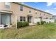 A view of the fenced backyard with grass at 57 Bella Lago Cir, Port Orange, FL 32129