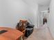 Hallway featuring wood table and a comfortable chair at 57 Bella Lago Cir, Port Orange, FL 32129