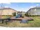 Community playground with slide, picnic table, and seating at 57 Bella Lago Cir, Port Orange, FL 32129